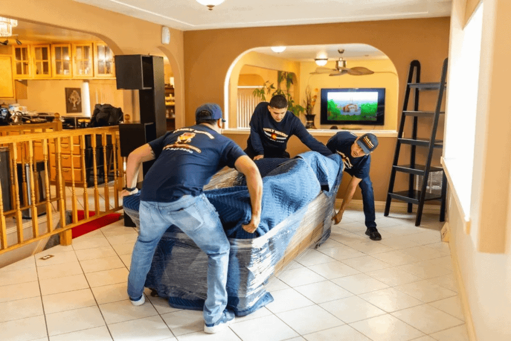 movers preparing couch.